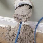 rotating brush tool removing lint from dryer vent