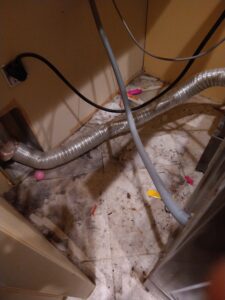 kinked dryer vent - fire hazard behind dryer