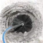 rotating brush, cleaning lint from inside a dryer vent