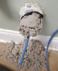 rotating brush tool removing lint from dryer vent